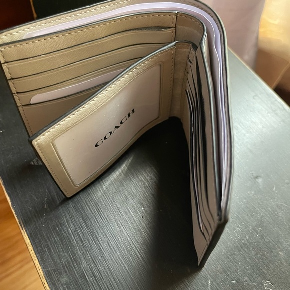Coach means wallet with picture insert. Never used - Picture 2 of 3